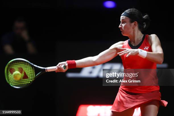 Anastasija Sevastova of Latvia on plays a forehand to Laura Siegemund of Germany during their round of 16 match on day 4 of the Porsche Tennis Grand...