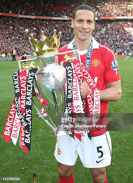 Rio Ferdinand of Manchester United celebrates with the Barclays Premier League trophy after the Barclays Premier League match between Manchester...