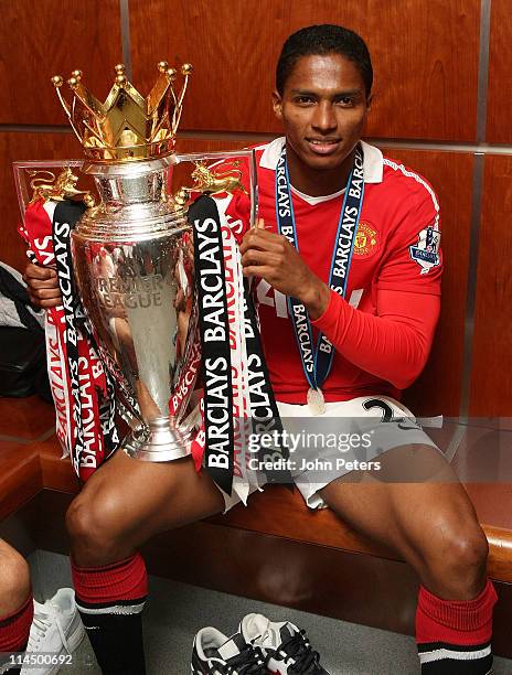 Antonio Valencia of Manchester United poses in the dressing room with the Barclays Premier League trophy after the Barclays Premier League match...