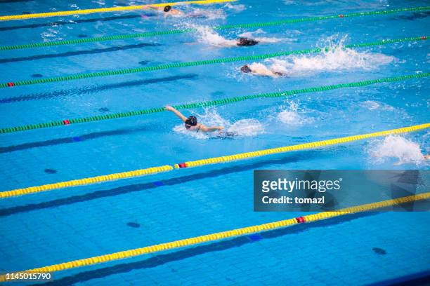 butterfly stroke swimming competition for women - the olympic games stock pictures, royalty-free photos & images