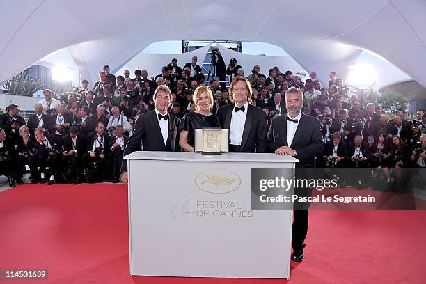 Producers Bill Pohlad and Dede Gardner pose with the Palme d'Or for 'The Tree of Life' at the Palme d'Or Winners Photocall at the Palais des...