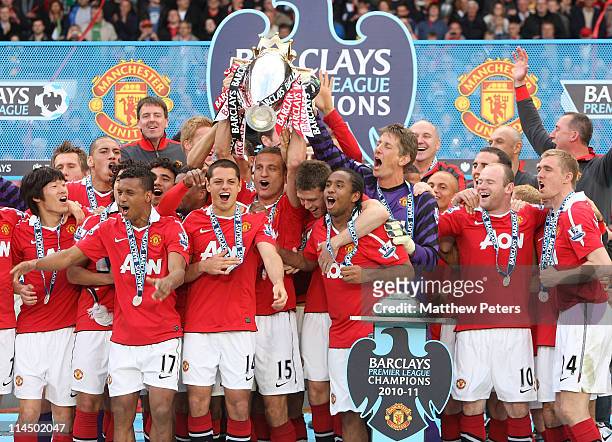 Nemanja Vidic of Manchester United lifts the Barclays Premier League trophy after the Barclays Premier League match between Manchester United and...
