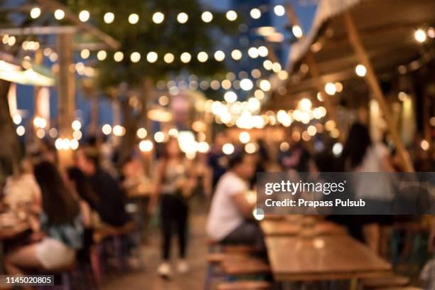 blurred background of restaurant with people. - shopping mall interior stock pictures, royalty-free photos & images