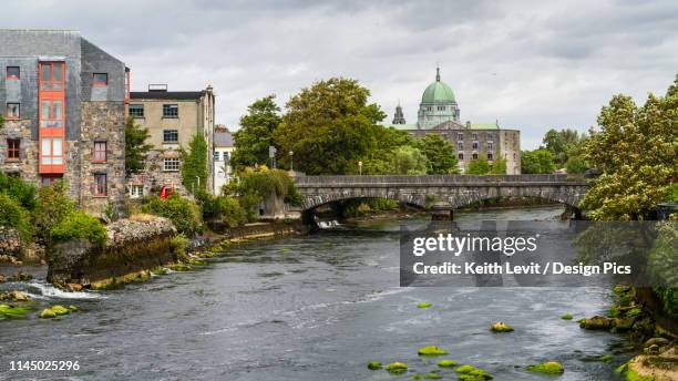 river corrib running through the city of galway in west ireland - galway stock pictures, royalty-free photos & images