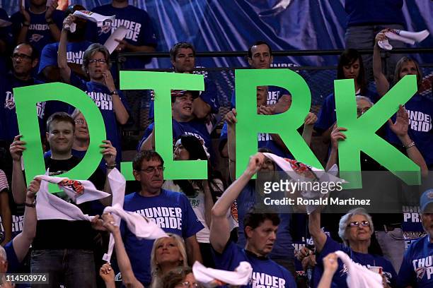 Fans hold of a saying spelling 'Dirk' for Dirk Nowitzki of the Dallas Mavericks before Game Three of the Western Conference Finals during the 2011...
