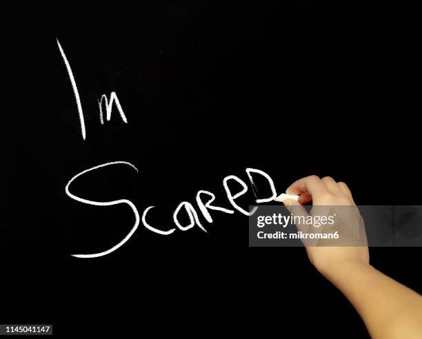 hand writing im scared with chalk in black board - fear of writing stock pictures, royalty-free photos & images