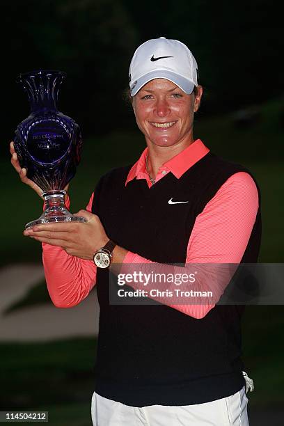 Suzann Pettersen of Norway poses with the trophy following her victory against Cristie Kerr in the final of the Sybase Match Play Championship at...