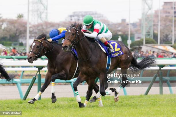 Jockey Christophe Lemaire riding Saturnalia wins the Satsuki Sho at Nakayama Racecourse on April 14, 2019 in Funabashi, Japan. It is the first leg of...