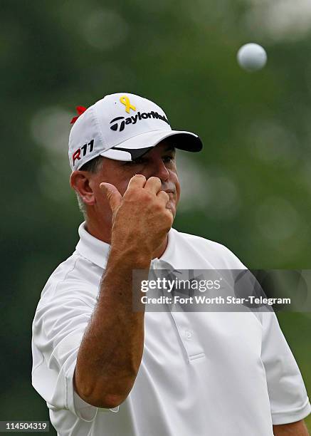 Paul Goydos throws his ball in the water after hitting a bogey on the ninth hole during the final round of the Crowne Plaza Invitational at Colonial...