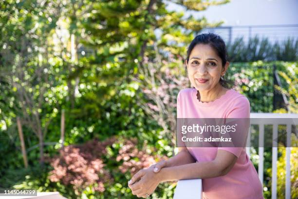 portrait of a beautiful mature indian woman - 50 year old indian lady stock pictures, royalty-free photos & images