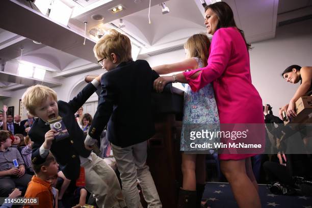 As her children stay close by, White House press secretary Sarah Sanders answers questions from children of White House staff and reporters on April...