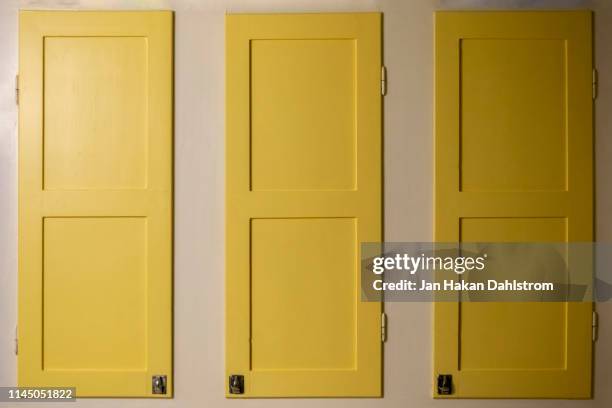 yellow kitchen cupboard doors - cabinet door stock pictures, royalty-free photos & images