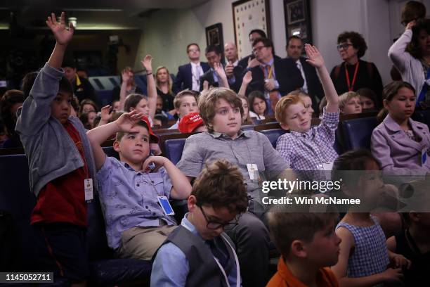 Children of White House staff and reporters ask questions during a briefing by White House press secretary Sarah Sanders on April 25, 2019 in...