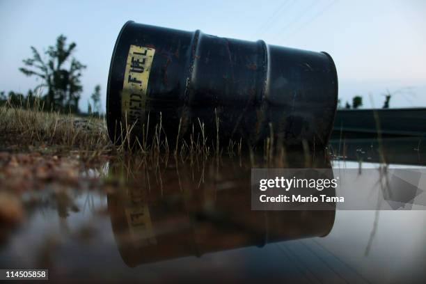 Used fuel barrel sits in the the Yazoo River floodwaters near Yazoo City May 22, 2011 in Yazoo County, Mississippi. Residents are being asked not to...