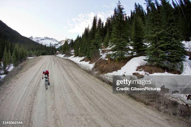 gravel road bicycle rider - gravel stock pictures, royalty-free photos & images