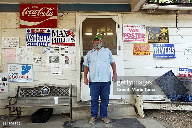 Farmer Don Trammell, whose home is currently flooded, stands outside a local convenience store near Yazoo City May 22, 2011 in Satartia, Mississippi....