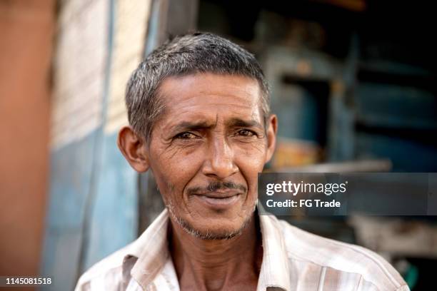 indian man portrait outdoors - farmer portrait stock pictures, royalty-free photos & images