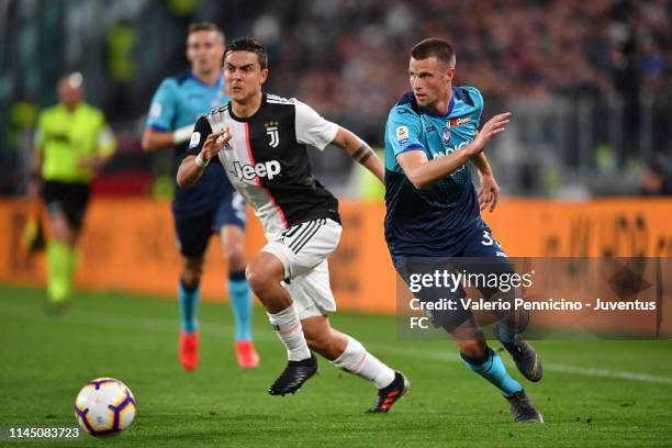 Paulo Dybala of Juventus competes for the ball with Hans Hateboer of Atalanta BC during the Serie A match between Juventus and Atalanta BC on May 19,...