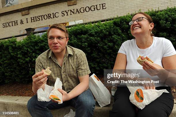 Co-workers Toby Friesen and Salem Pearce enjoy their corned beef sandwiches at the 6th &amp; I Historic Synagogue on May 20, 2011 in Washington, D.C....