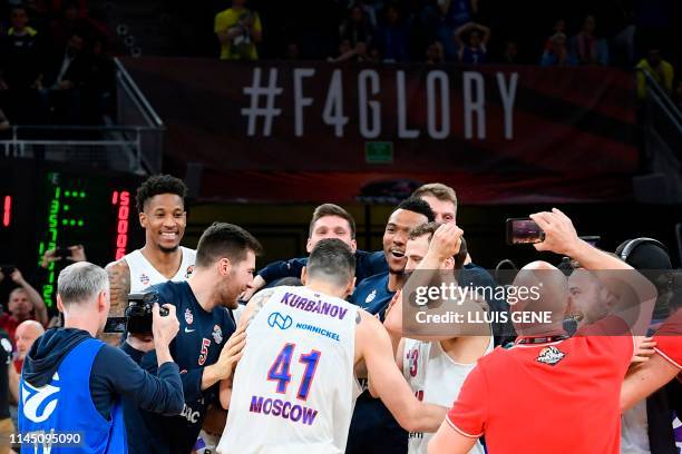 Moscow players celebrate after winning the EuroLeague final basketball against Anadolu Efes at the Fernando Buesa Arena in Vitoria on May 19, 2019.