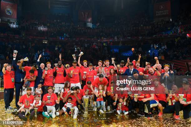 Moscow's players pose wit the trophy after winning the EuroLeague final basketball against Anadolu Efes at the Fernando Buesa Arena in Vitoria on May...