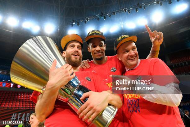 Moscow's Spanish guard Sergio Rodriguez , CSKA Moscow's US forward Will Clyburn and CSKA Moscow president Andrey Vatutin hold the trophy after...