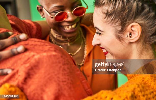 colourful portrait of a small group of friends having fun together - cultural diversity stock-fotos und bilder