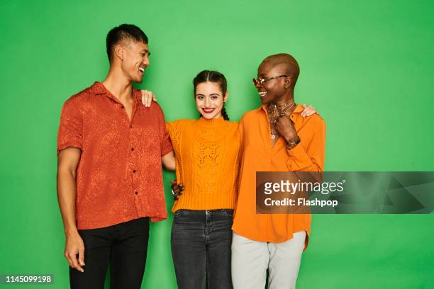 colourful portrait of a small group of friends having fun together - portraits of people and studio stock pictures, royalty-free photos & images