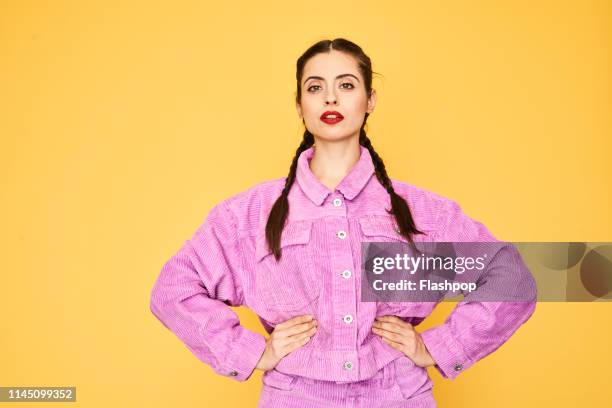 colourful studio portrait of a young woman - swagger stock pictures, royalty-free photos & images