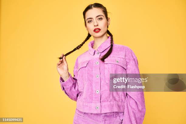 colourful studio portrait of a young woman - gay person color background stock pictures, royalty-free photos & images