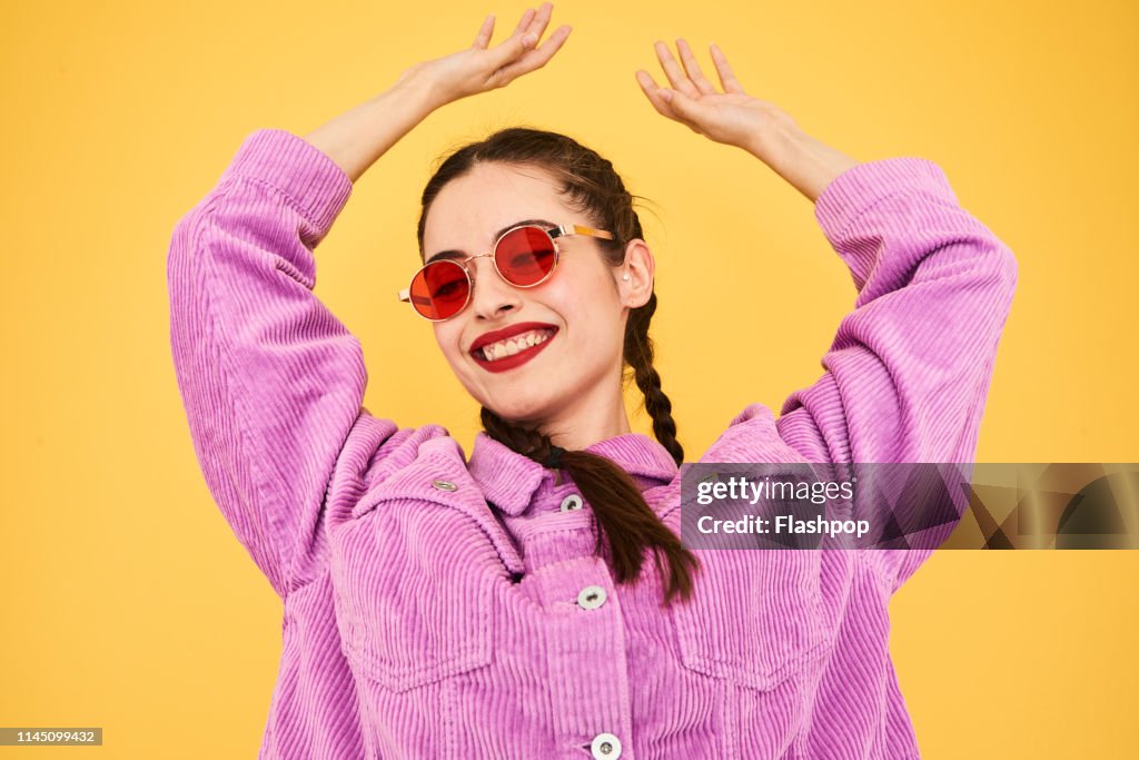 Colourful studio portrait of a young woman