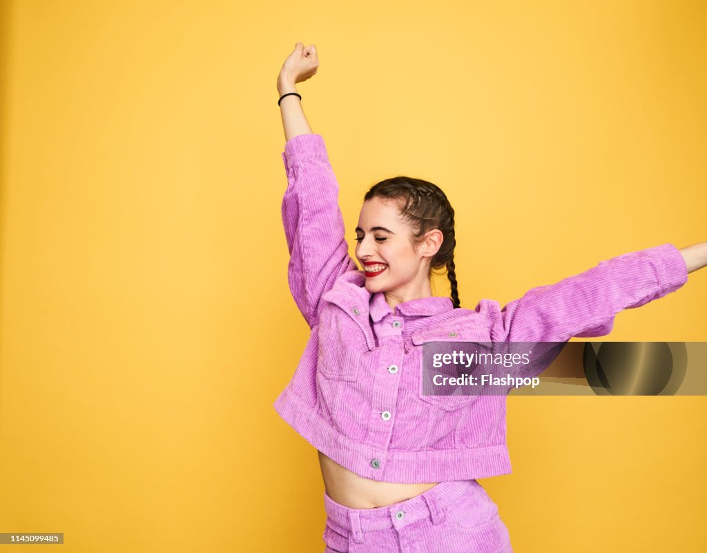 Colourful studio portrait of a young woman