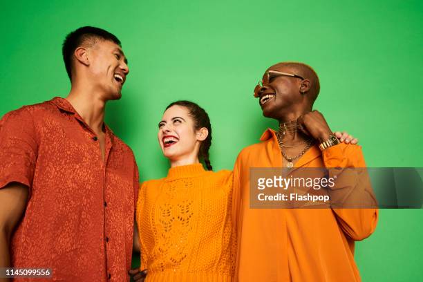 colourful portrait of a small group of friends having fun together - gay person color background stock pictures, royalty-free photos & images