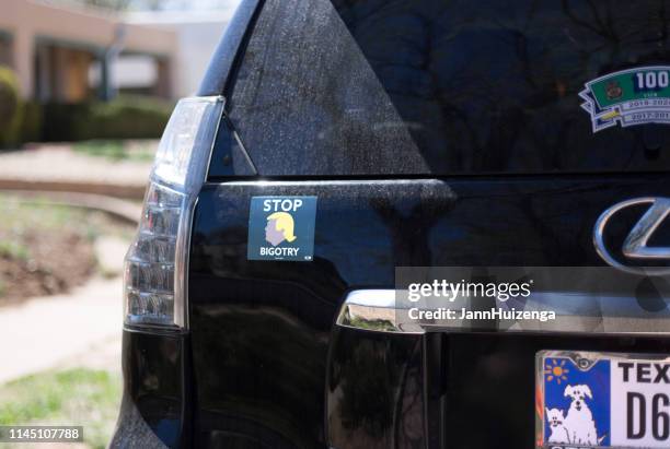 santa fe, nm: "stop bigotry" bumper sticker on car - trump bumper sticker stock pictures, royalty-free photos & images