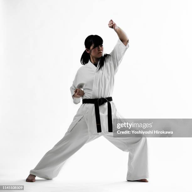 young teen japanese woman doing karate - karate belt stock pictures, royalty-free photos & images