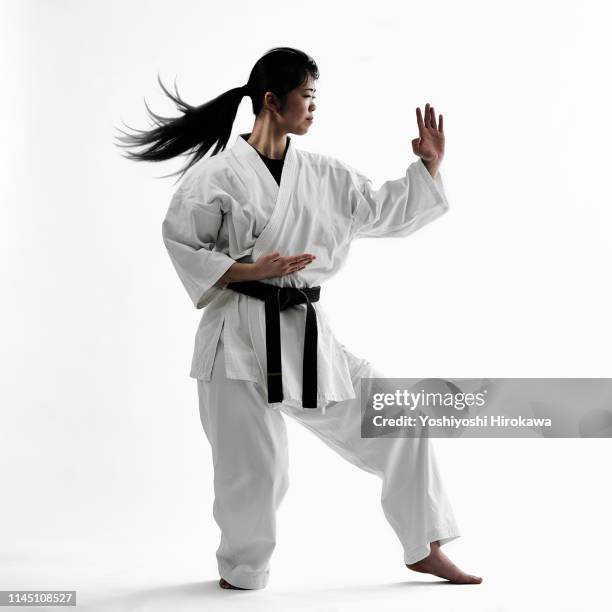 young teen japanese woman doing karate - karate belt stock pictures, royalty-free photos & images