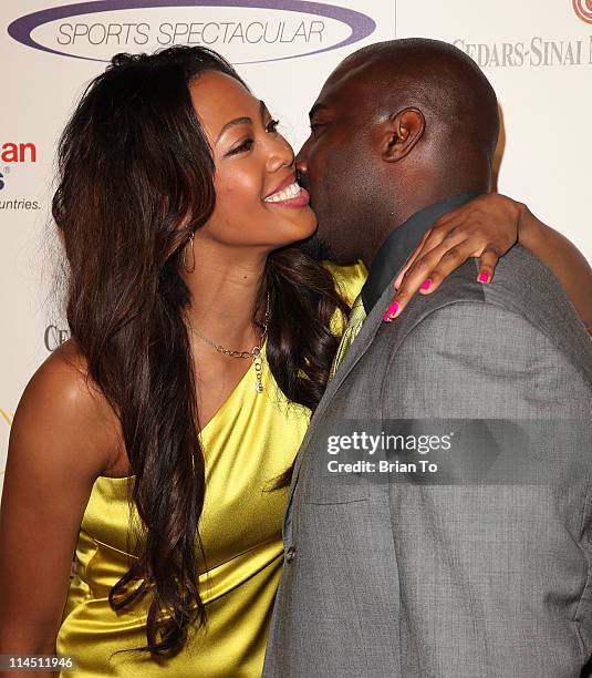 Former NFL player Marcellus Wiley and Kim Glass attend 26th Anniversary Sports Spectacular at the Hyatt Regency Century Plaza on May 22, 2011 in...