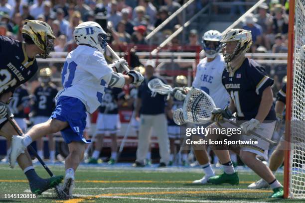 Dukes attack Joey Manown dives for the score during the Division I Men's Lacrosse Championship - Quarterfinals game between the Notre Dame Fighting...