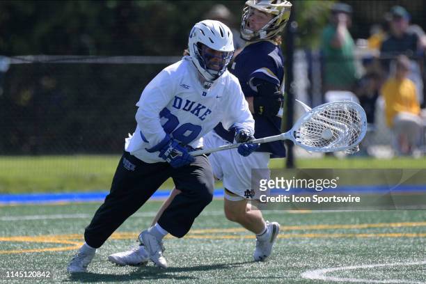 Dukes goalie Turner Uppgren controls the ball during the Division I Men's Lacrosse Championship - Quarterfinals game between the Notre Dame Fighting...