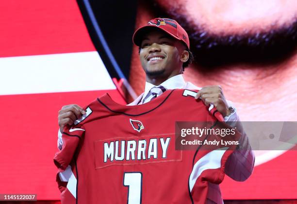 Kyler Murray Oklahoma reacts after he was picked overall by the Arizona Cardinals during the first round of the 2019 NFL Draft on April 25, 2019 in...