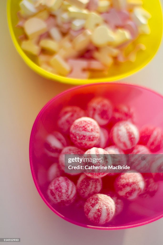 Yellow and pink bowl filled with sweets