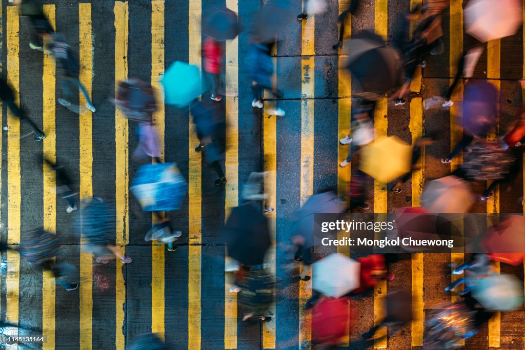 Top view of people crossing a very busy crossroads at Mong Kok district Hong Kong in China