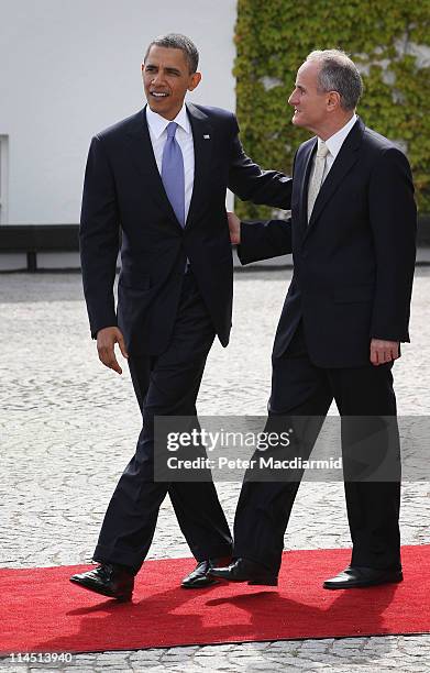 President Barack Obama walks with Dr Martin McAleese husband of Irish President Mary McAleese at Áras an Uachtaráin on May 23, 2011 in Dublin,...