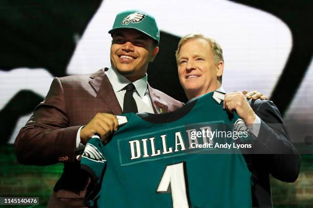 Andre Dillard of Washington State poses with NFL Commissioner Roger Goodell after being chosen overall by the Philadelphia Eagles during the first...