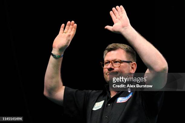 James Wade of England acknowledges the fans as he walks out prior to his match against Michael van Gerwen of the Netherlands during the 2019 Unibet...