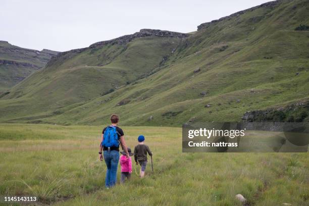 mother and her kids hiking - drakensberg mountain range stock pictures, royalty-free photos & images