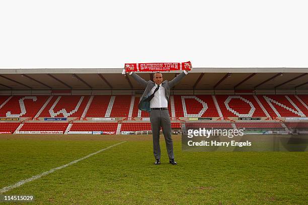 Paolo di Canio poses for photographers during a press conference to announce his arrival as manager of Swindon Town FC at County Ground on May 23,...
