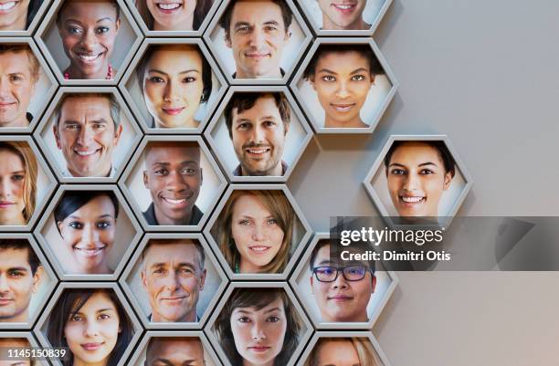 group of hexagonal portrait pods, one joining - diversity concept stock pictures, royalty-free photos & images