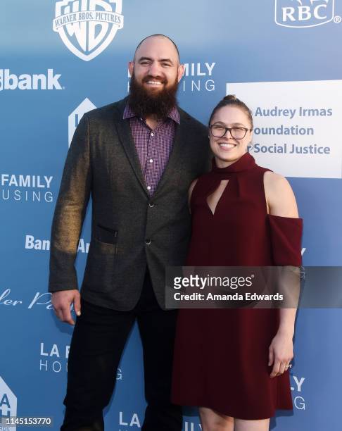 Travis Browne and Ronda Rousey arrive at the LA Family Housing Annual LAFH Awards and Fundraiser Celebration at The Lot on April 25, 2019 in West...