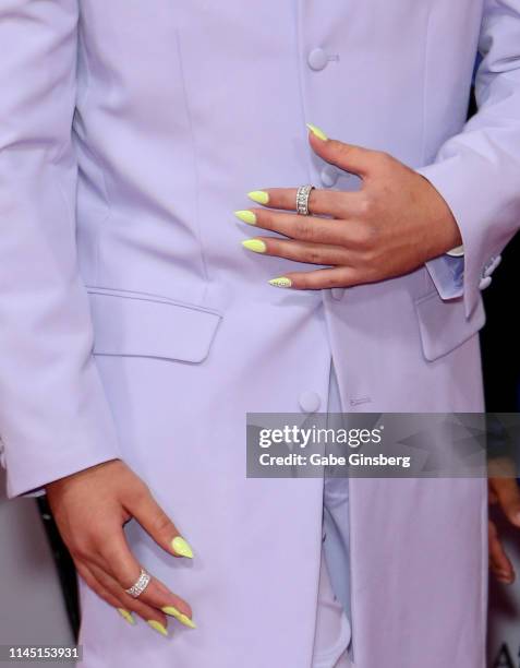 Singer Bad Bunny, nails and rings detail, attends the 2019 Billboard Latin Music Awards at the Mandalay Bay Events Center on April 25, 2019 in Las...